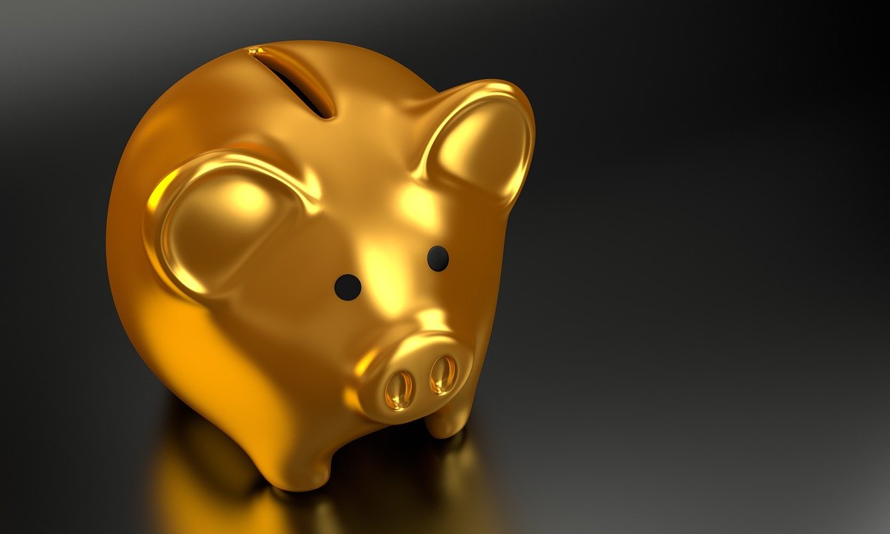 A gold piggy bank represents gold investments.